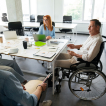man-wheelchair-having-office-job